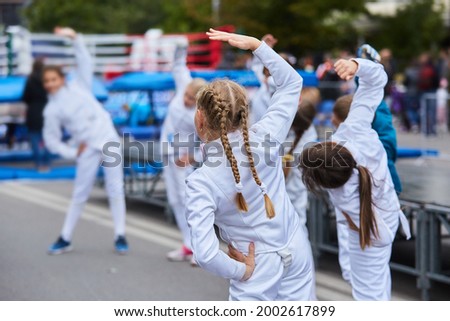 body parts of the athlete fencing in a suit uniform with a sword and mask. An active Olympic sport. Training for children and adults.