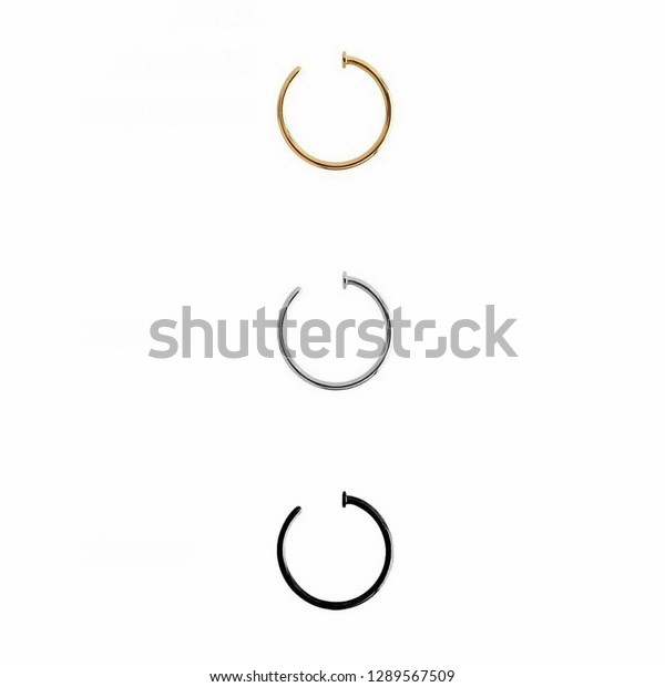 BODY PIERCING OPEN NOSE RINGS JEWELRY IN GOLD\
SILVER AND BLACK ON WHITE\
BACKGROUND