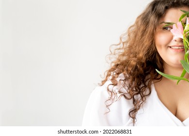 Body Positive. Happy Curvy Woman. Natural Beauty. Plus Size Perfection. Pretty Smiling Fatty Lady Curly Hair Posing With Pink Flower Branch Isolated White Copy Space.