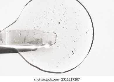 Body serum with a glass pipette on a white background top view. Cosmetic background, skin care. - Shutterstock ID 2311219287