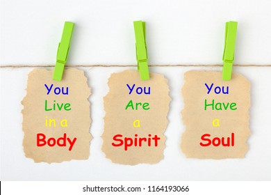 Body Spirit Soul Written On Old Torn Paper With Clip Hanging On White Background.
