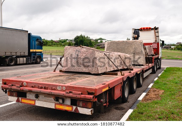 Body of the truck loaded
with marble slabs in a stone cutting factory. transport of huge
stone slabs
