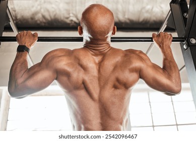 Bodybuilder, back training and man for pull ups, fitness or workout for strength. Guy, endurance and sports athlete for cardio, muscle power and health club exercise performance with morning routine