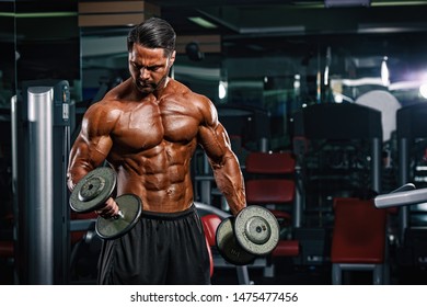 Bodybuilder Lifting Weights, Performing Dumbbell Bicep Curls