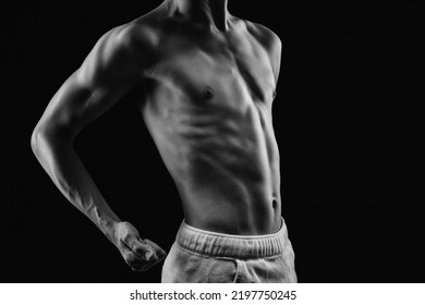 Bodybuilder Shows His Muscles On The Body. He Concept Of Proper Nutrition And Healthy Lifestyle. Photo Black And White