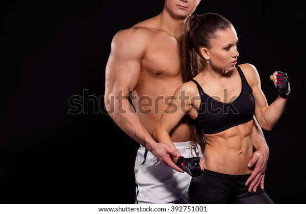Bodybuilder touches girl flexing bicep photo gym wallpaper mural