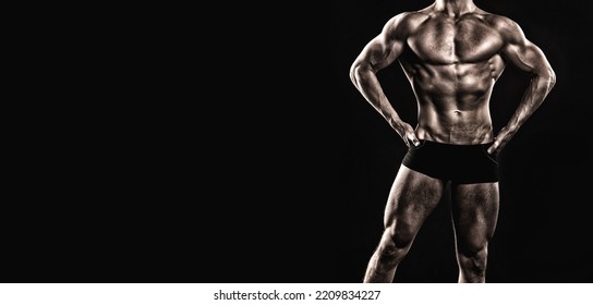 Bodybuilding Pose Of Muscular Bodybuilder. Bodybuilder In Bodybuilding Pose Isolated On Black.