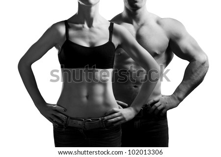 Bodybuilding. Strong man and a woman posing. Isolated on white background