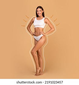 Bodycare And Sculpting Concept. Female Model In White Top Bra And Panties Posing With Massage Lines And Arrows On Her Body Isolated On Beige Studio Background