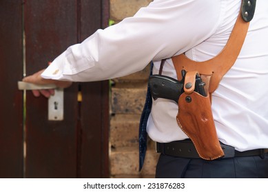 Bodyguard With Gun Opens The Door