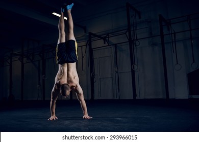 Bodyweight training, man standing on hands