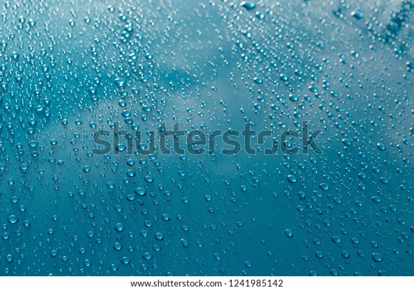 bodywork of car\
covered by water drops after storm, cleaned with wax, polished,\
weather, background,\
Italy