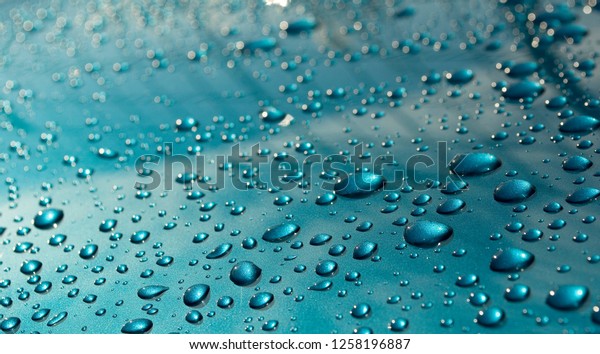 bodywork of car
covered by water drops after storm, cleaned with wax, polished,
weather, background,
Italy