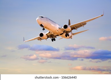 Boeing 737 Flying In Sunset Sky.