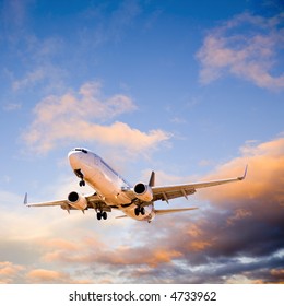 Boeing 737 Flying In Sunset Sky.