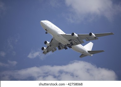 A Boeing 747 airliner coming in for landing on final approach