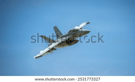 Boeing F-15EX Eagle II fighter jet in flight with beautiful cloudy blue sky background.
