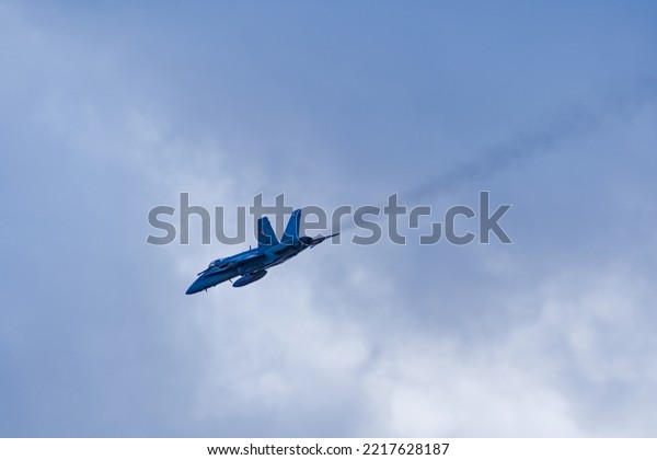 Boeing FA-18 Hornet of Swiss Air\
Force in the Swiss Alps at Axalp, Canton Bern, on a blue cloudy\
autumn day. Photo taken October 18th, 2022, Axalp,\
Switzerland.