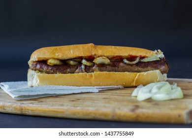 Boerewors Roll (traditional South African Food) Grilled Sausage On A Roll With Fried Onions With Catch Up 