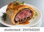 Boeuf en Croûte: Also known as Beef Wellington, this dish features beef tenderloin wrapped in puff pastry with a layer of pâté or mushrooms.