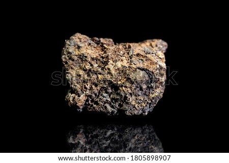 Bog iron ore, raw rock on black background, mining and geology, extraction and industrial