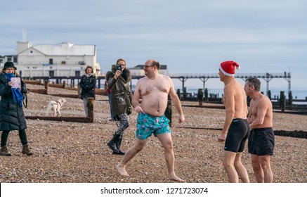 Bognor Regis, Sussex / UK - 1 January 2019: A Group Of Hardy Friends Take To The Icy Waters Of The English Channel For A Traditional New Year's Day Swim Cheered On By Family And Friends.