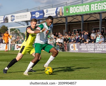 
Bognor Regis, Sussex, UK - 11 Sept 2021: Football (soccer) Action From Isthmian Premier League (Southern). Carshalton Player Tackles A 'Rocks' Striker In Front Of A Packed Crowd Of Spectators.