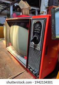 BOGOR, INDONESIA - February 15th, 2021 - TV Portable With Sanyo Brand 17 Portable Ac Dc In Space Red On Wood Texture