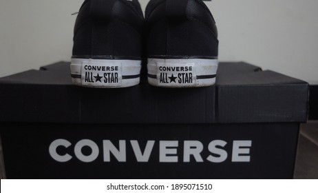 Bogor, Indonesia - January 16th 2021 :
Back View Of A Pair Of Bluish Black Converse Shoes On Top Of The Converse Shoe Box