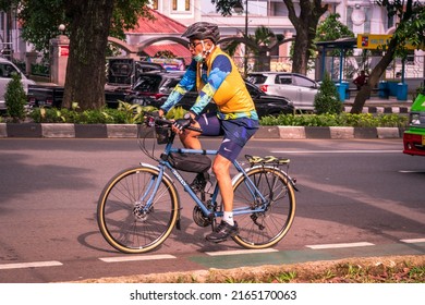 Bogor, Indonesia - May 31, 2022: A Man Exercising On A Road Bike On The Highway