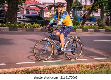 Bogor, Indonesia - May 31, 2022: A Man Exercising On A Road Bike On The Highway