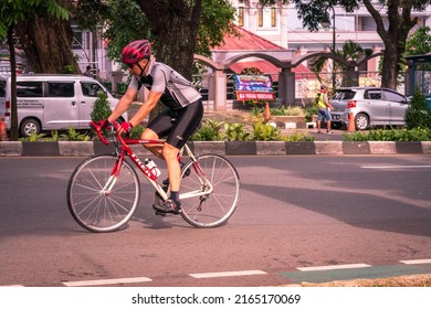 Bogor, Indonesia - May 31, 2022: A Man Exercising On A Road Bike On The Highway