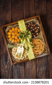 Bogor, west Java,  Indonesia 20 March 2022 : Selective focus of Hampers gift on Assorted Indonesian Cookies for Eid al Fitr. Served beautiful hampers with Nastar, choco cookies and kaastengels .
