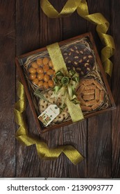 Bogor, west Java,  Indonesia 20 March 2022 : Selective focus of Hampers gift on Assorted Indonesian Cookies for Eid al Fitr. Served beautiful hampers with Nastar, choco cookies and kaastengels .