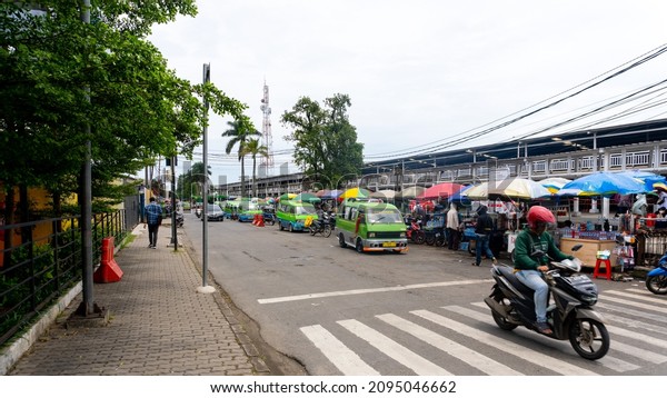 Bogor, West Java - November\
12, 2021: Photo of public transportation (Angkot) around Bogor\
station