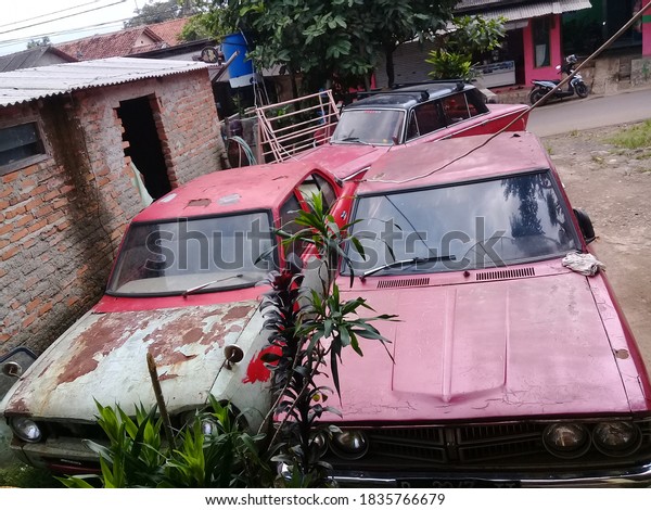 Bogor, West Java, October, 17,2020, an\
old red vehicle at a used goods place in\
Indonesia