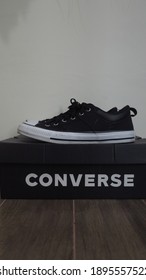 Bogor,Indonesia - January 16th 2021 : 
The Left Side View Of A Pair Of Black Converse Shoes That Are On Top Of The Converse Box