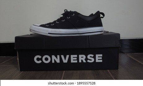 Bogor,Indonesia - January 16th 2021 : 
The Left Side View Of A Pair Of Black Converse Shoes That Are On Top Of The Converse Box