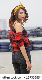 Bogor-Indonesia, January 9th 2019 -  Girl In Checkered Red With Headband Posing At The Circuit Arena