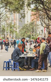 BOGOTA, COLOMBIA, 24.2.2017: People Playinga Game Of Chess On A Street In Columbia Capital Bogota. Busy Street With Players.