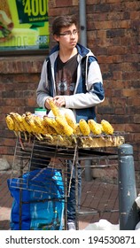 BOGOTA, COLOMBIA - MAY 06, 2014: Vendor Selling Food Along A Busy Street In Bogota. Street Vendors Are Very Common In The Streets Of Bogota.