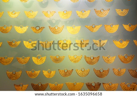 BOGOTA, COLOMBIA - NOV 18, 2019: Gold artifacts on display in the Museo del Oro (Gold Museum).