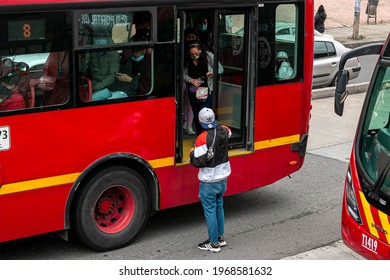 BOGOTA,COLOMBIA; MAY 4TH 2021: Bogota Citizens Getting Down From Transmilenio Buses Due A Traffic Jam Caused By A Protest Nearby.