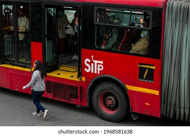 BOGOTA,COLOMBIA; MAY 4TH 2021: Bogota Citizens Getting Down From Transmilenio Buses Due A Traffic Jam Caused By A Protest Nearby.