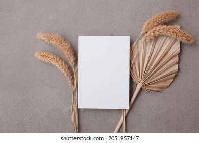 Bohemian Blank Invitation Card Surrounded By Natural Dried Palm Leaf And Grasses. Wedding And Celebration Background