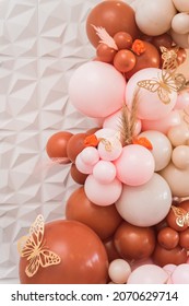 Bohemian color balloon garland with butterfly accents for celebration