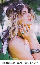 Bohemian Hippie Girl In White Dress.
Woman Hands With Lot Of Boho Style Jewelry, Blue Rings,silver Bracelets And Henna Tattoo. Coachella Fashion Style Look, Outfit.