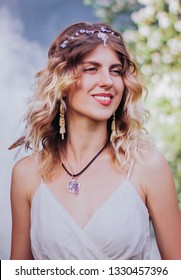 Bohemian Hippie Girl In White Dress.
Woman Hands With Lot Of Boho Style Jewelry, Blue Rings,silver Bracelets And Henna Tattoo.  Coachella Fashion Style Look, Outfit.