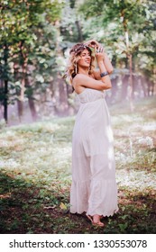 Bohemian Hippie Girl In White Dress Dancing In The Forest.
Soft Vintage Color Tone. Coachella Fashion Style Look, Outfit.