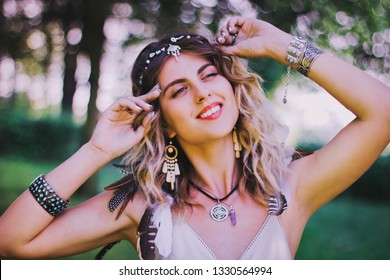 Bohemian Hippie Girl In White Dress.
Woman Hands With Lot Of Boho Style Jewelry, Blue Rings,silver Bracelets And Henna Tattoo.Coachella Fashion Style Look, Outfit.